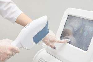 Modern equipment. Laser hair removal. Personal care. Light background.