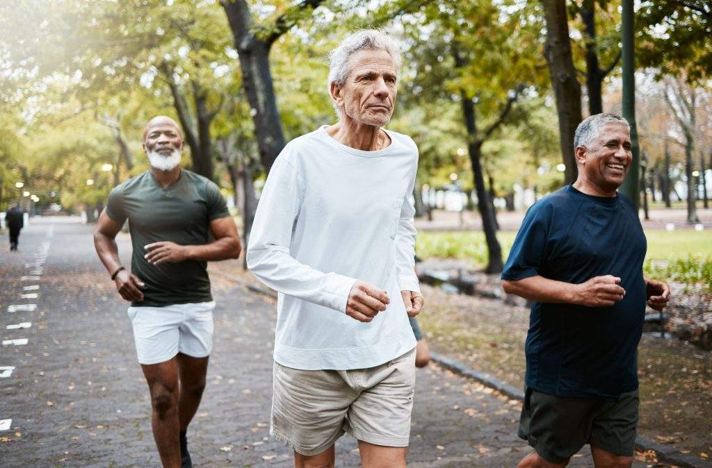Run, group and senior men training, running and in street for health, wellness and fitness outdoor. Retirement, healthy males and friends running together, strong workout and exercise for cardio.
